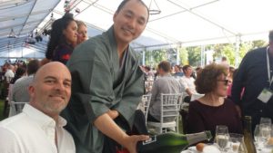 Takaki pours a glass of Champagne Billecart-Salmon for Master Sommelier Cameron Douglas