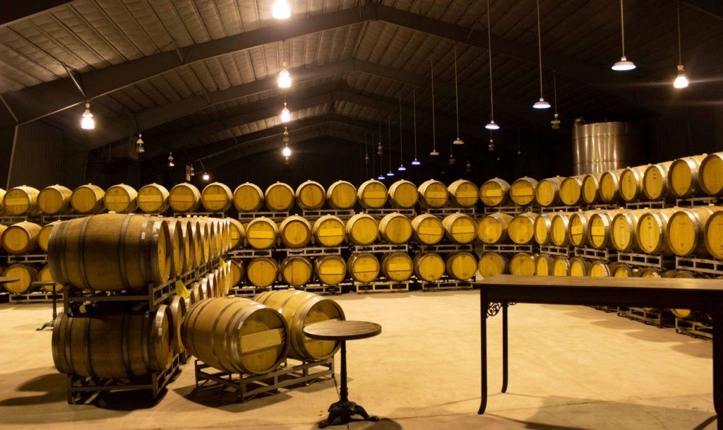 Oak wine barrels at Caymus Winery